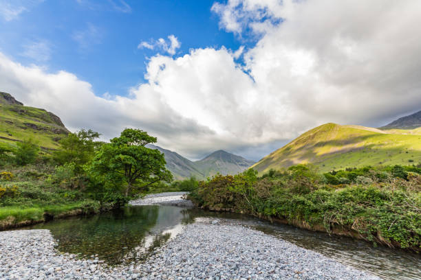istock River with trees and mountains in the background 638162392
