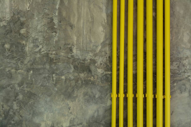 Yellow Pipe on Loft Grunge Wall Background stock photo