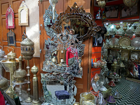 Fez, Morocco - December 27, 2016: Varied life in medina in Fez. You can get lost in endless narrow streets full of craftsmen, shops, people, food etc.