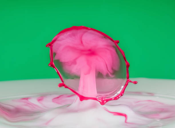 istock Milk droplets colliding together to make droplet art. 638166250