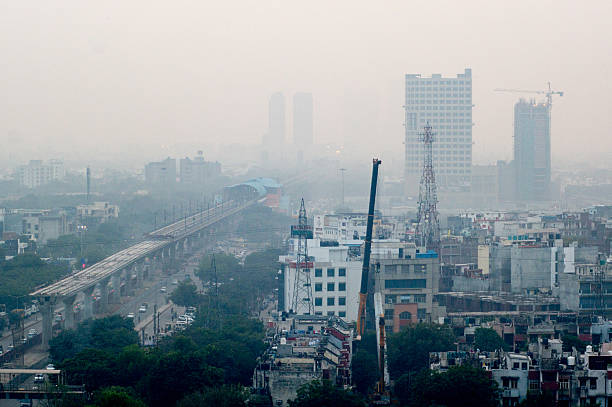 Pollution in Noida Delhi against the cityscape stock photo