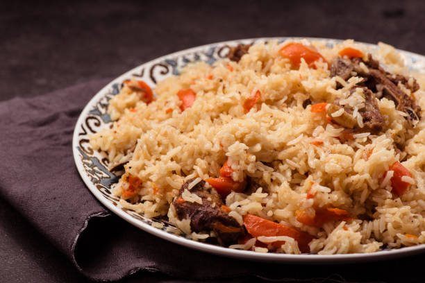 istock Pilaf on plate with oriental ornament. Central-Asian cuisine - 638168062