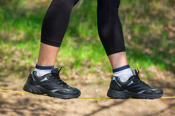 istock Tightrope walker is on a tight sling. 638170446