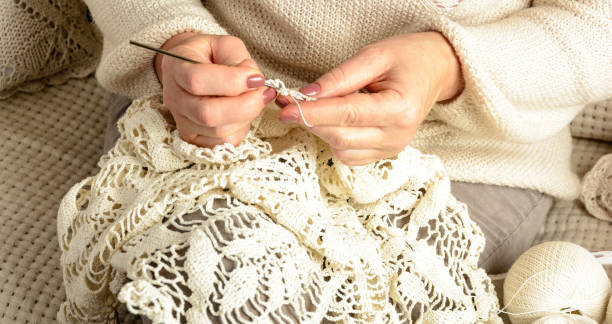 istock woman crochet tablecloth 638171118
