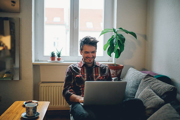 istock Young man doing a freelance job from home 638178854