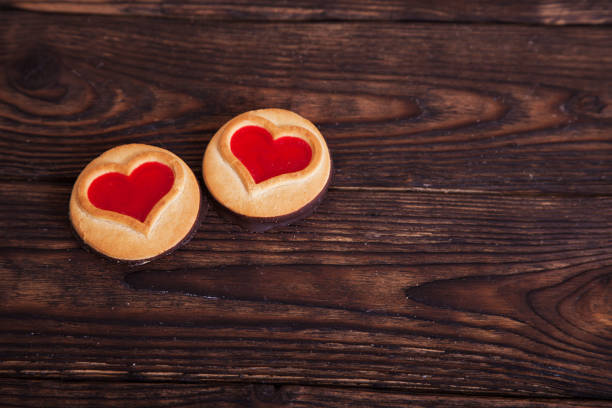 istock Two hearts cookies on the wooden table 638181444