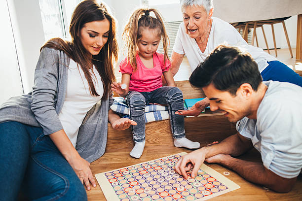 istock Happy family playing a game 638181510