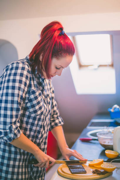 istock happy woman cooking on kitchen 638184662