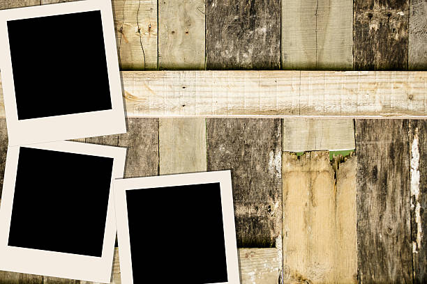 istock Blank, polaroid-style photographs on rustic wooden table. 638185282