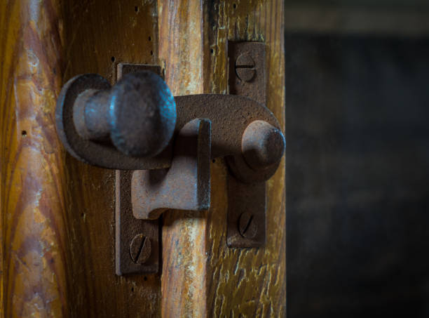 istock The iron latch on a wooden door 638185462