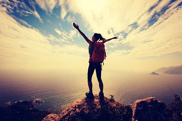 istock successful woman backpacker hiking on mountain peak 638186880