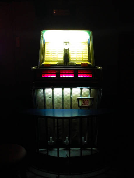 istock Vintage American jukebox lite up, in a dark room 638186936