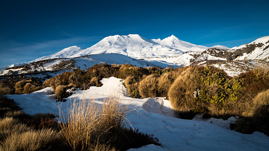 Wide panoramic winter view of Mount Ruapehu photographed from the carpark of the Turoa ski field lower carpark.