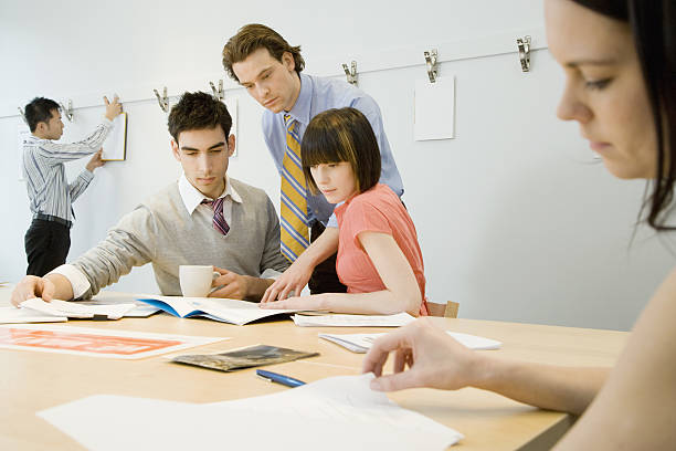 istock Group of office colleagues collaborating together in meeting 638188440