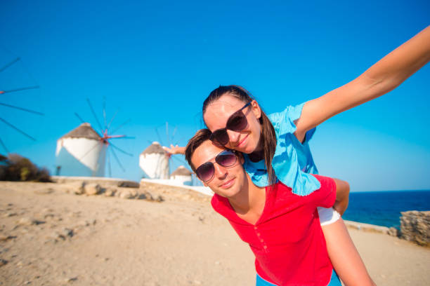 istock Young couple taking selfie with a stick in front of 638190546