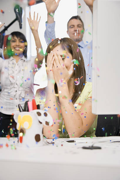 Woman in office with hands on face during celebration surprise Woman in office with hands on face during celebration surprise Hidden Meaning stock pictures, royalty-free photos & images