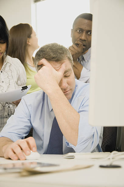 istock Group of business people frustrated with result on computer screen 638191136