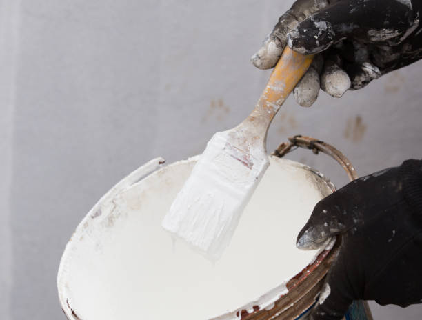 istock white paint brush with paint tin 638198950