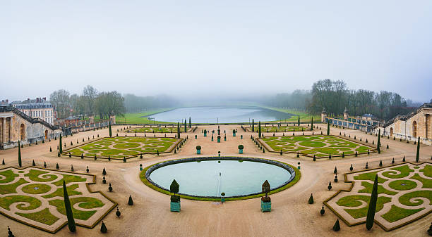 Paris, France - January 7, 2016: Gardens of Versailles Apollo Fountain. Versailles was a hunting lodge until King Louis XVI transformed it into a palace during the 17th century.