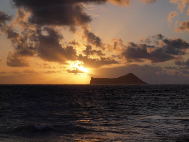 istock Sunrise next Rabbit Island over Waimanalo Ba 638201274