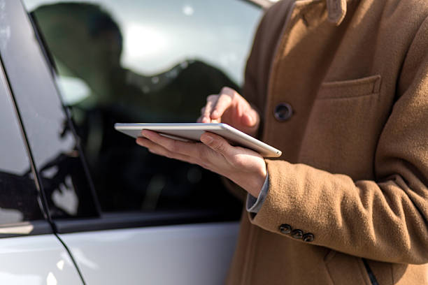 istock young asian man with tablet on road 638201782