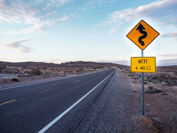 istock curved ahead road warning drivers at freeway road 638202120