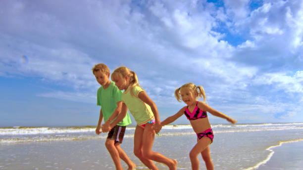 istock Kids Running in Ocean 638207188