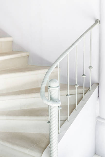 istock White stairs with vintage white railing 638208570