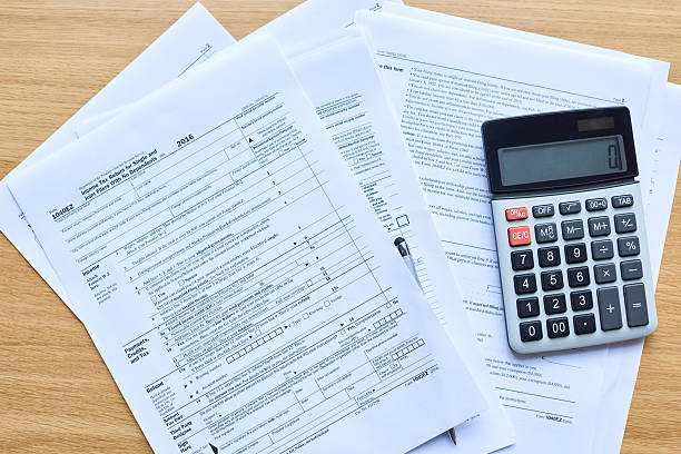 istock Tax form and calculator 638210730