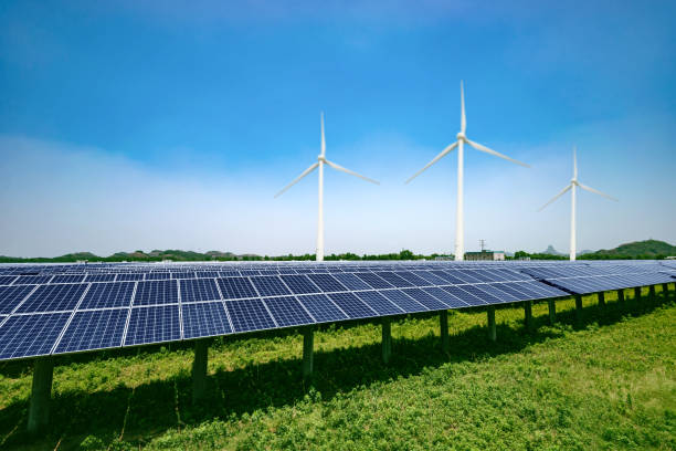 istock solar panels and wind generators under blue sky on sunset 638211522