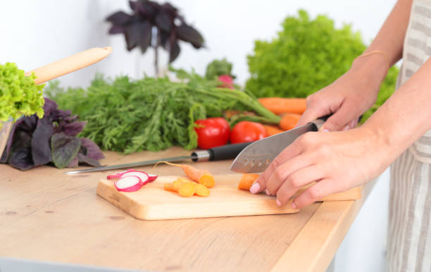 istock Fresh vegetables on the cutting board are falling in the 638212012