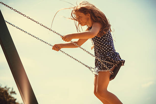 istock Girl swinging on swing-set. 638214678