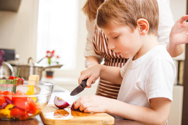 istock Small boy cooking together with his mother 638219806