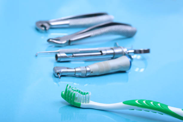 istock dental care toothbrush with dentist tools on mirror background. 638220584