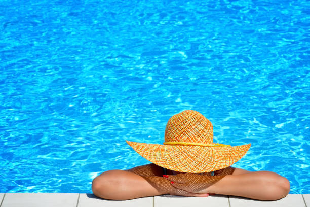 istock Real female beauty relaxing at swimming pool 638227308