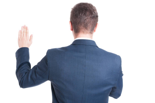istock Back view of politician standing raising hand taking oath 638237348