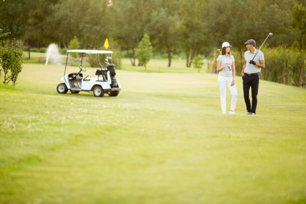 istock Young couple at golf cart 638240494
