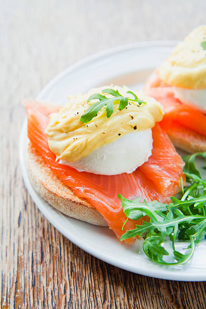 istock Smoked Salmon Eggs Benedict with Hollandaise Sauce on English Muffin. 638241684