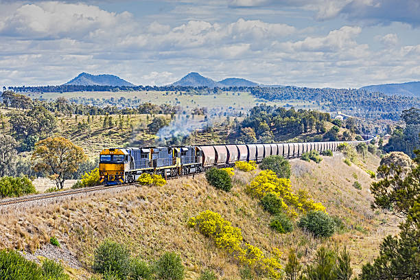 grimy coal train in scenic, picturesque landscape - train coal mining australia imagens e fotografias de stock