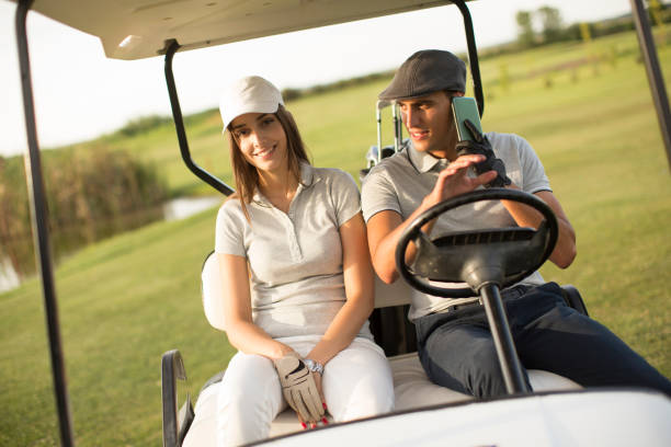 istock Young couple at golf cart 638243280