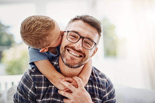 I love you, daddy! Cropped portrait of a father bonding with his son at home single father stock pictures, royalty-free photos & images
