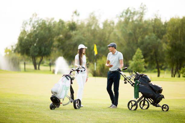 istock Young couple at golf cart 638246096