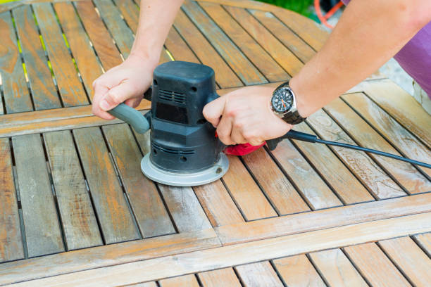 istock Close-up of carpenter's hands working with electric sander 638246520