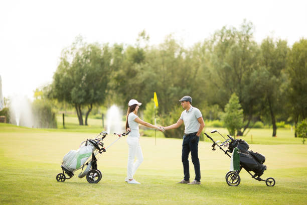 istock Young couple at golf cart 638247472