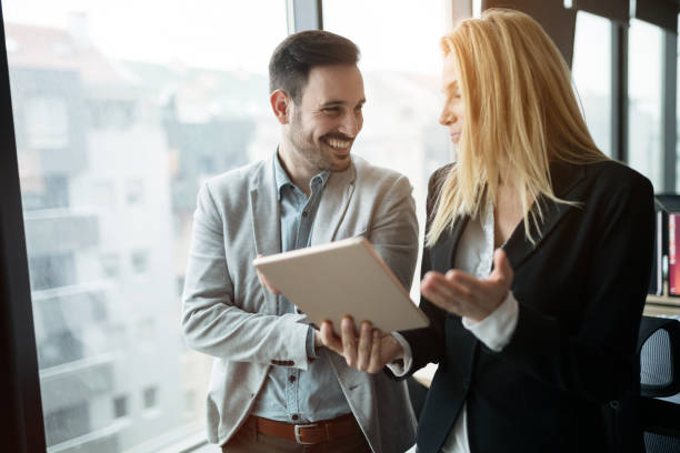 istock Happy business colleagues in modern office 638249022