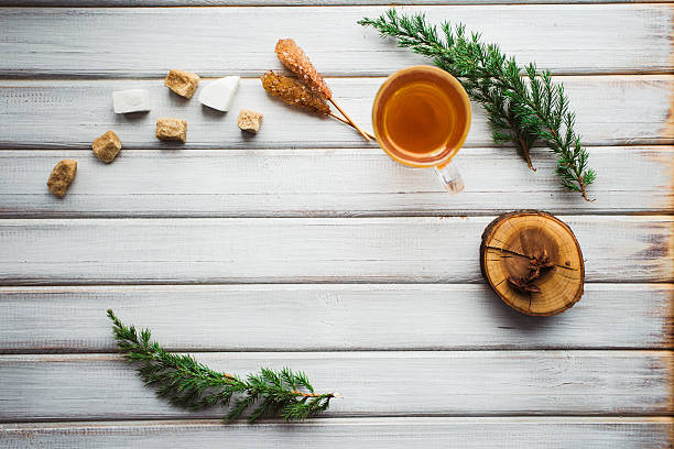 istock Cup of tea and cane sugar. On wooden background. 638250466