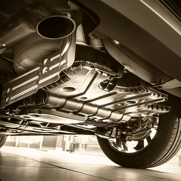 istock Car in repair shop view from below 638252124
