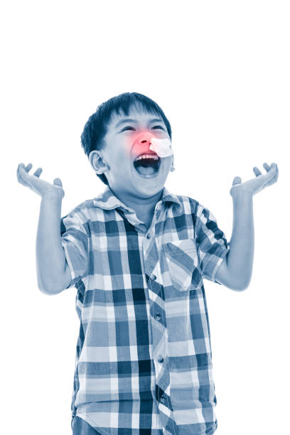 istock Asian boy with tissue into nose. Isolated on white background. 638254378