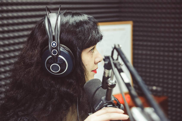 istock the girl at the microphone in the Studio 638254668