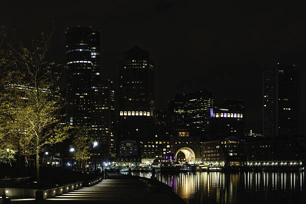 Rowes Wharf pre-dawn from Fan Pier Early morning view of Rowes Wharf in Boston from Fan Pier harborwalk stock pictures, royalty-free photos & images